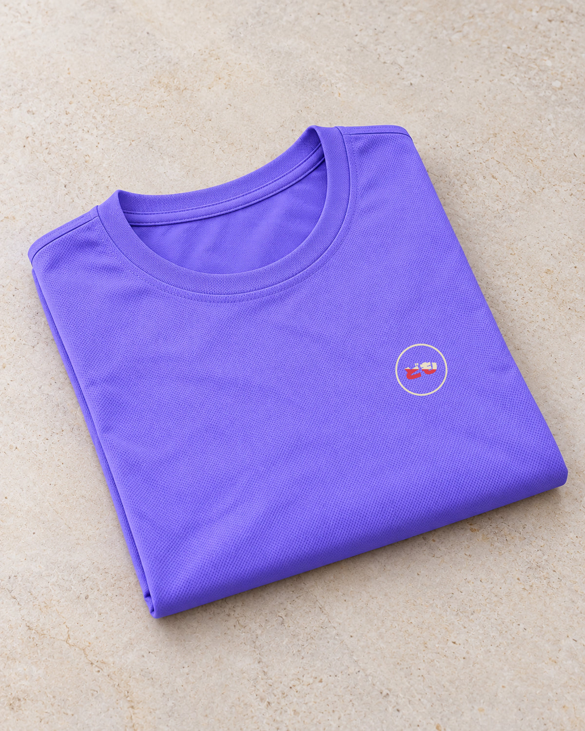 Kaze Sport Women 風 | Ink — folded shirt showing the Domo chest logo