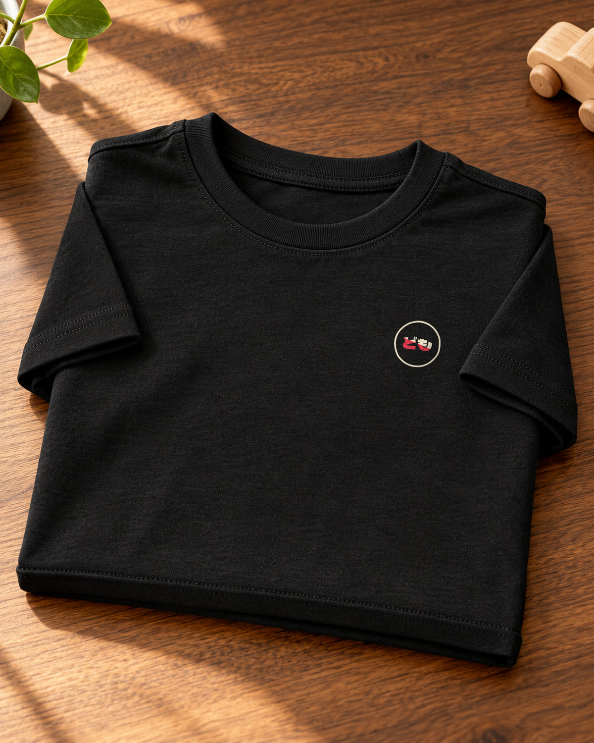 Wakaba Kids Tee 若葉 | Ink — folded garment showing the Domo chest logo