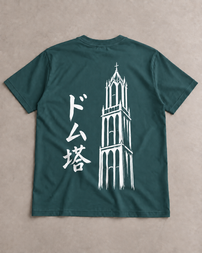 Kata Tee Embroidered 型 | Ink — back view laid flat on a table, showing the printed Ink artwork