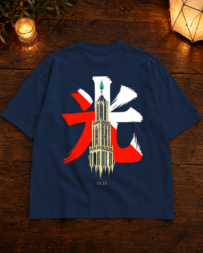 Fudō Tee 不動 | Candle — Navy — volledig kledingstuk met rugontwerp op tafel