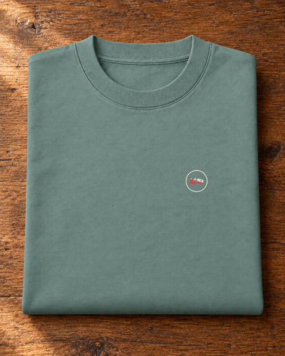 Fudō Tee 不動 | Ink — folded garment showing the Domo chest logo