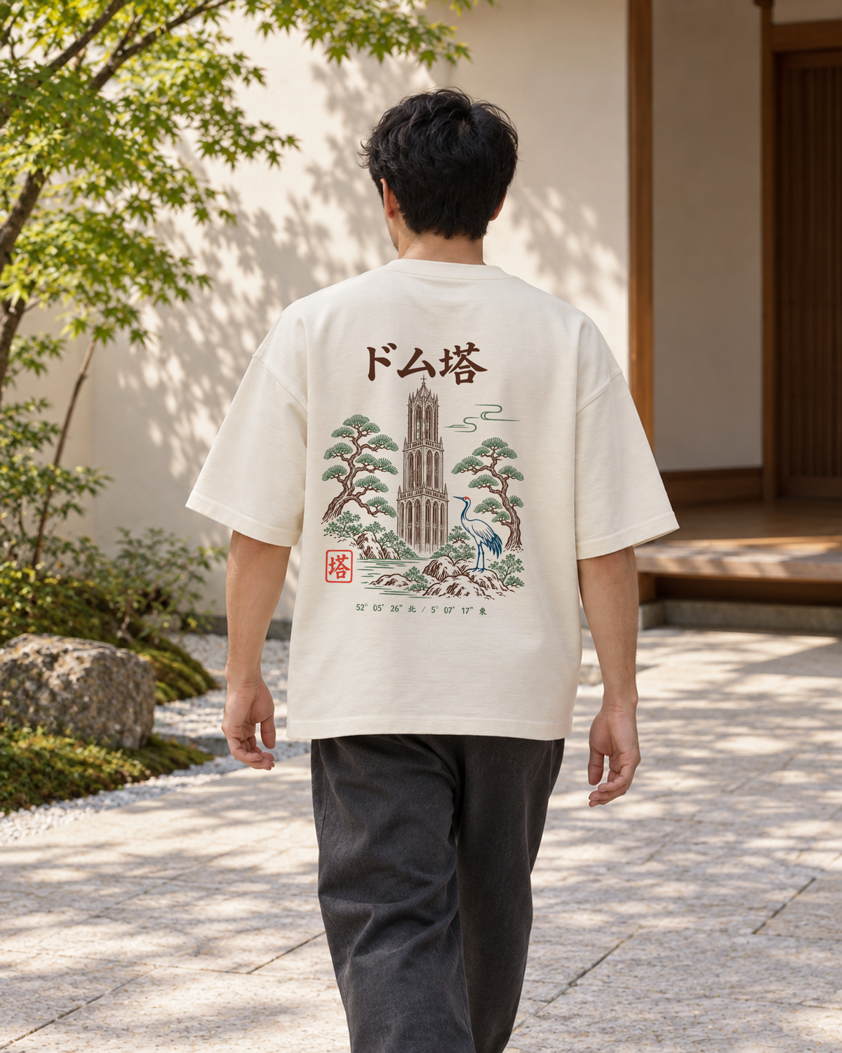 Fudō Tee 不動 | Zen Light — back view showing the artwork in a Japanese setting
