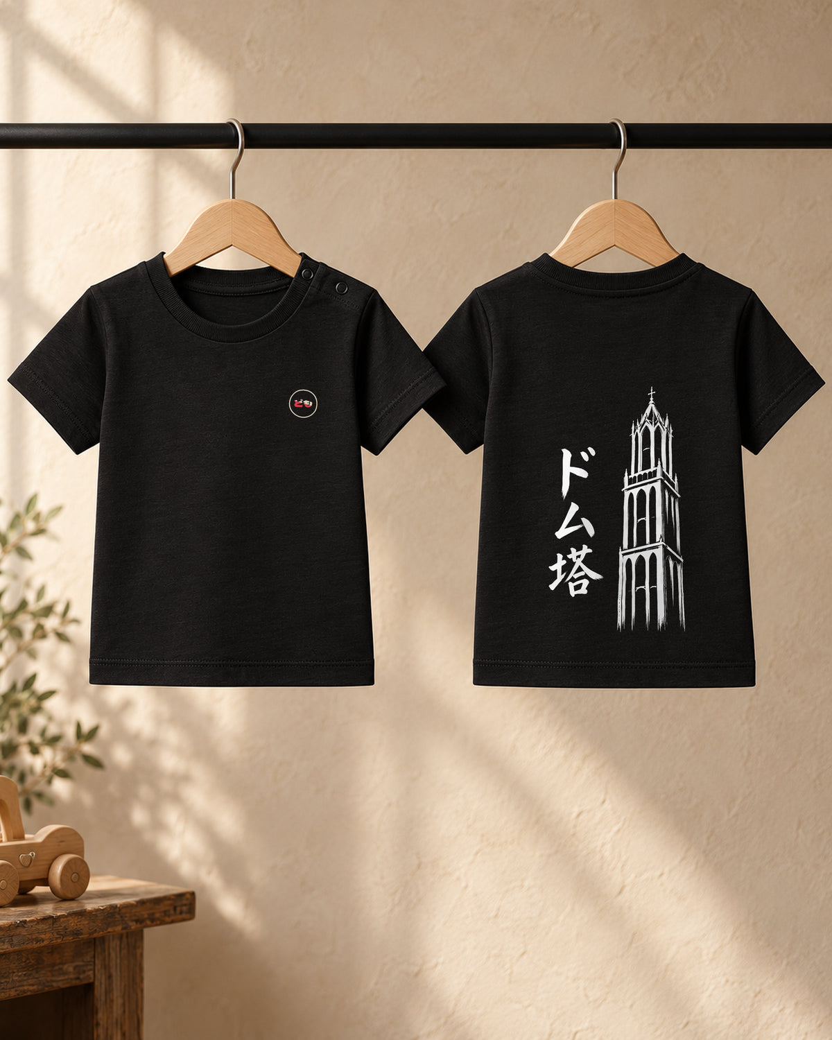 Hina Baby Tee 雛 | Ink — front and back views on hangers