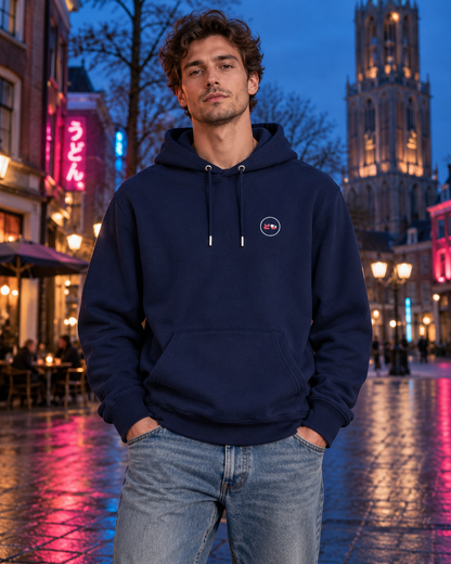 Nukumori Cruiser 2.0 350 GSM organic cotton fleece hoodie: RELAXED MEDIUM FIT, roomy chest and upper arms, shoulders gently relaxed, loose straight body and natural drape, comfortable streetwear, NOT slim or tight, NOT extreme oversized — Neo — front logo on model