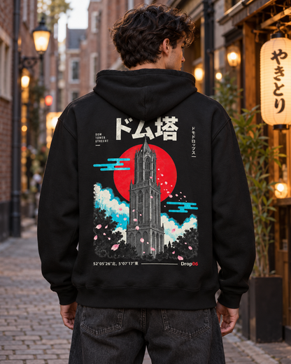 Nukumori Cruiser 2.0 350 GSM organic cotton fleece hoodie: RELAXED MEDIUM FIT, roomy chest and upper arms, shoulders gently relaxed, loose straight body and natural drape, comfortable streetwear, NOT slim or tight, NOT extreme oversized — Origin Dark — back artwork on model