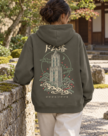 Nukumori Cruiser 2.0 350 GSM organic cotton fleece hoodie: RELAXED MEDIUM FIT, roomy chest and upper arms, shoulders gently relaxed, loose straight body and natural drape, comfortable streetwear, NOT slim or tight, NOT extreme oversized — Zen Dark — back artwork on model