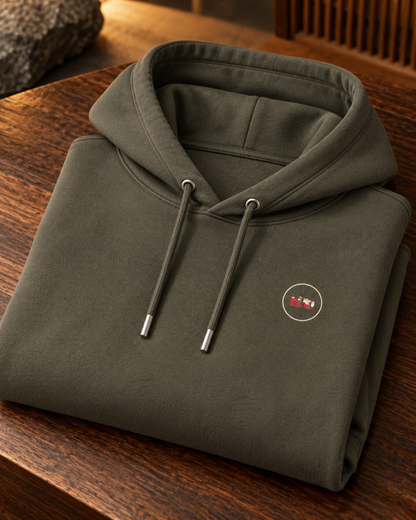 Nukumori Cruiser 2.0 unisex relaxed-medium-fit 350 GSM hoodie — folded garment, cotton fabric and printed Domo chest logo