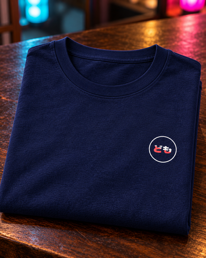 Kata Tee 型 | Neo — folded cotton tee with the circular printed Domo chest logo
