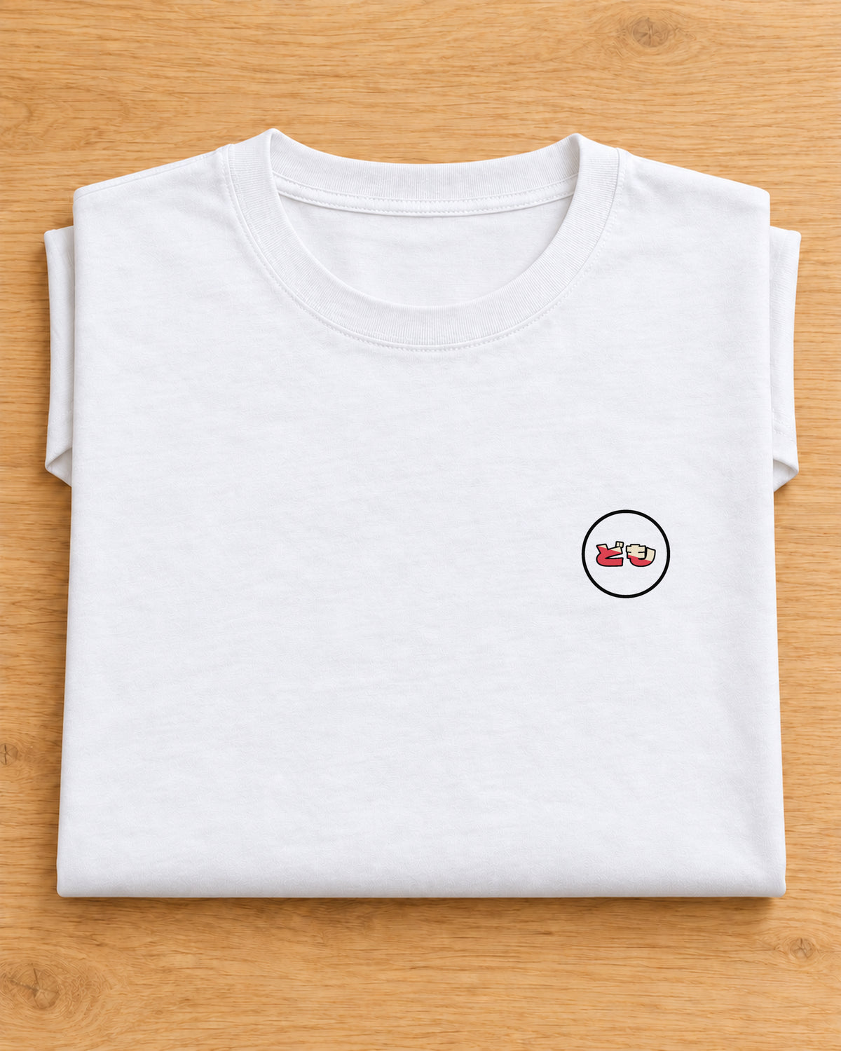 Kata Tee 型 | Origin Light — folded garment showing the Domo chest logo