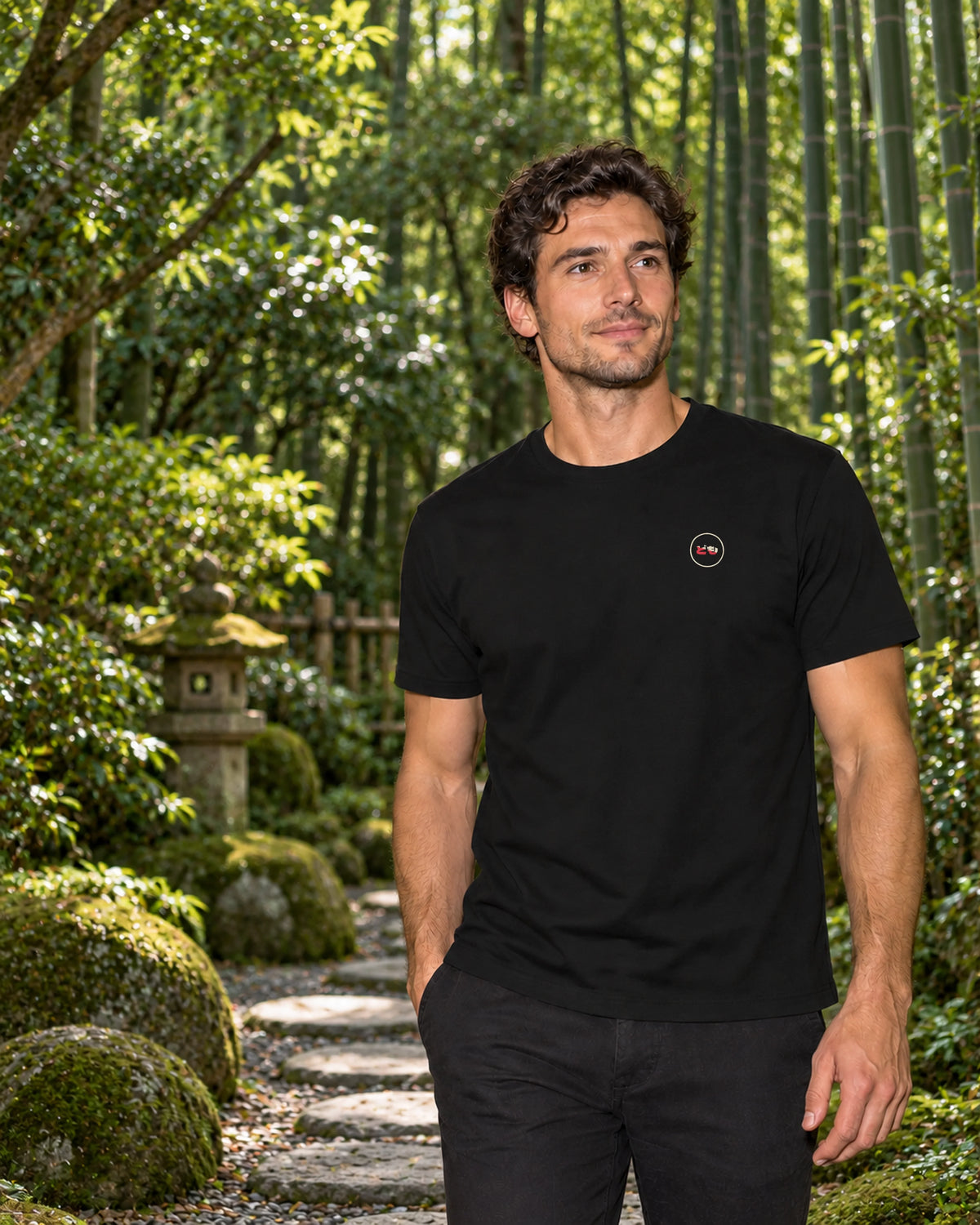 Kata Tee 型 | Zen Dark — front view showing the Domo chest logo in a Japanese setting