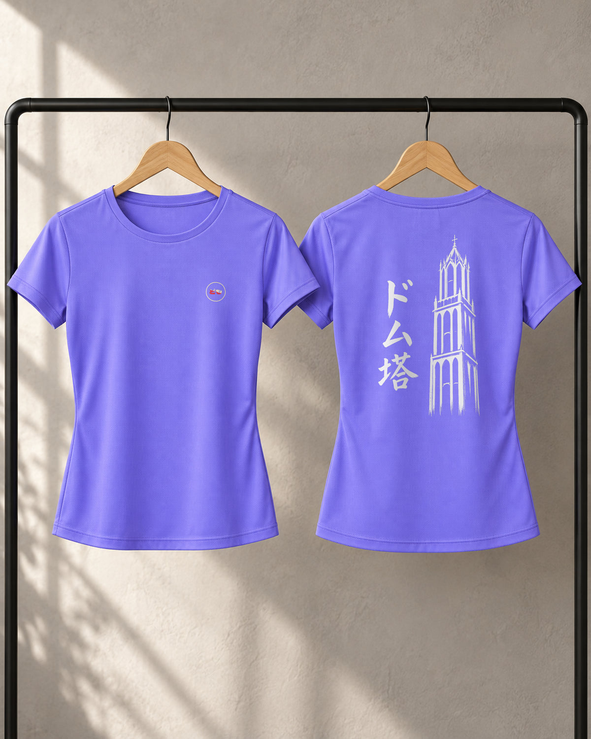 Kaze Sport Women 風 | Ink — front and back views on a clothing rack, showing the chest logo and Ink back print