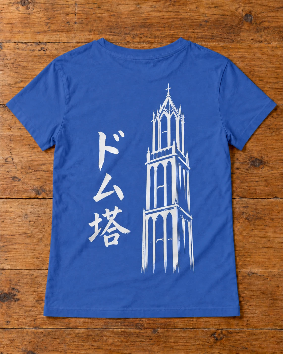 Saki Tee 咲 | Ink — back artwork laid flat on a table