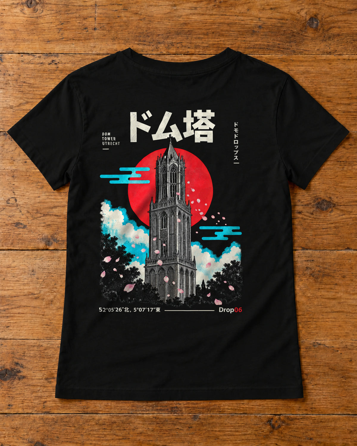 Saki Tee 咲 | Origin Dark — back artwork laid flat on a table
