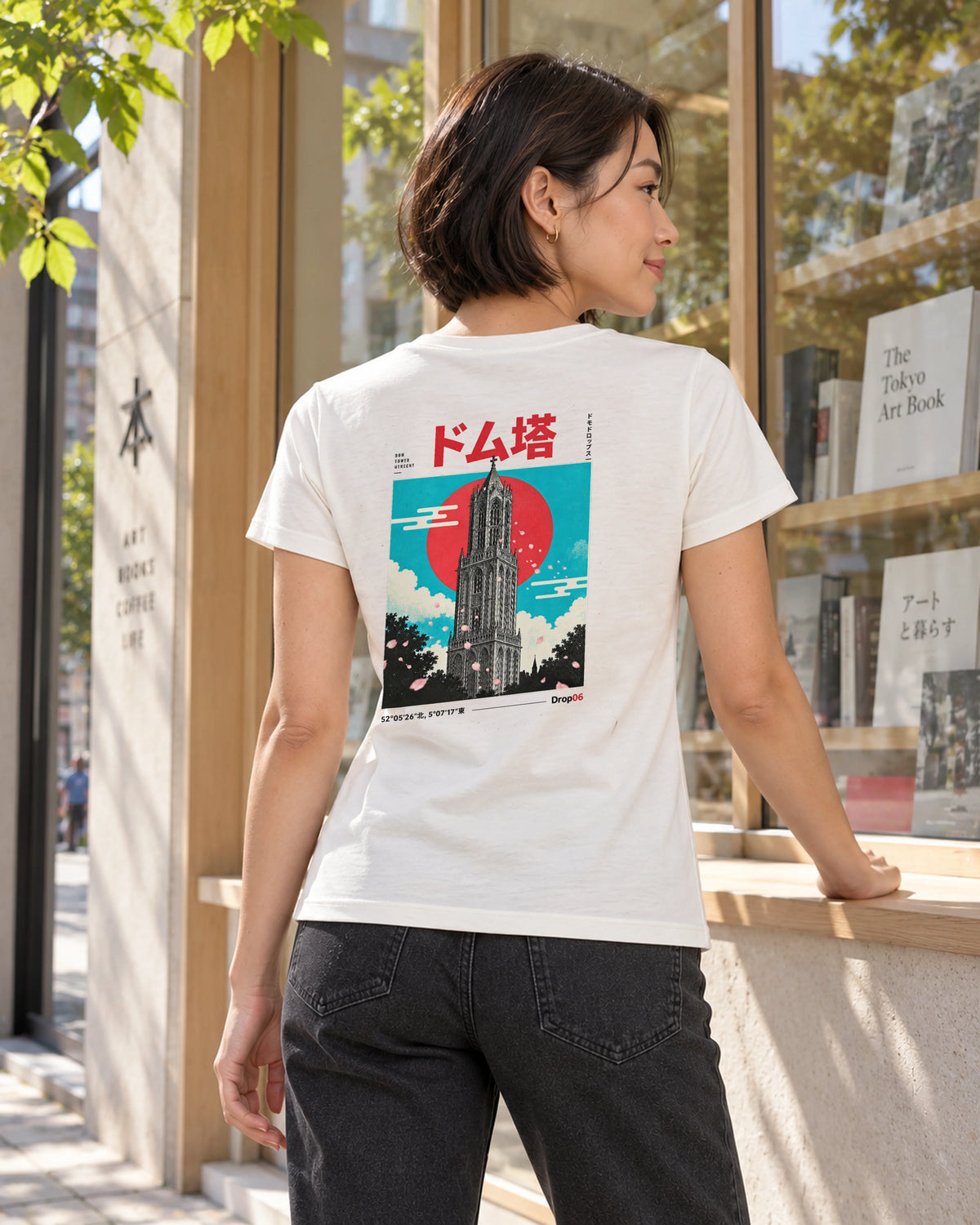 Saki Tee 咲 | Origin Light — back view showing the artwork in a Japanese setting