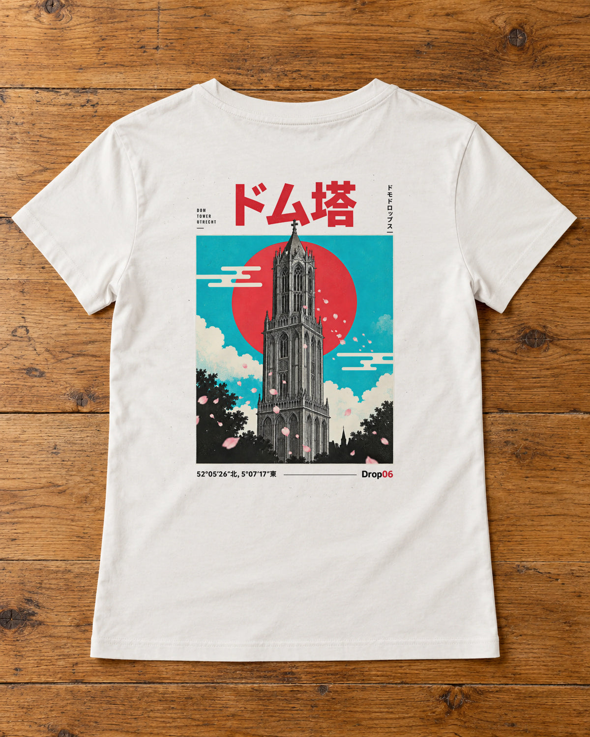 Saki Tee 咲 | Origin Light — back artwork laid flat on a table