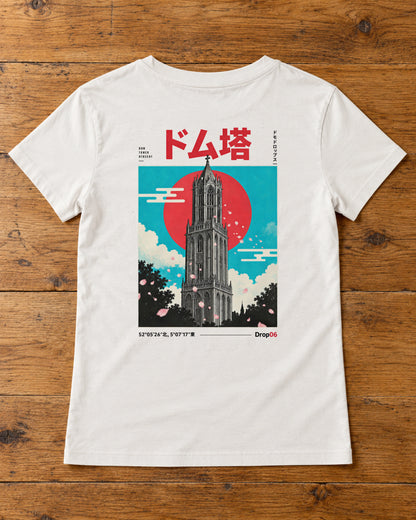 Saki Tee 咲 | Origin Light — back artwork laid flat on a table