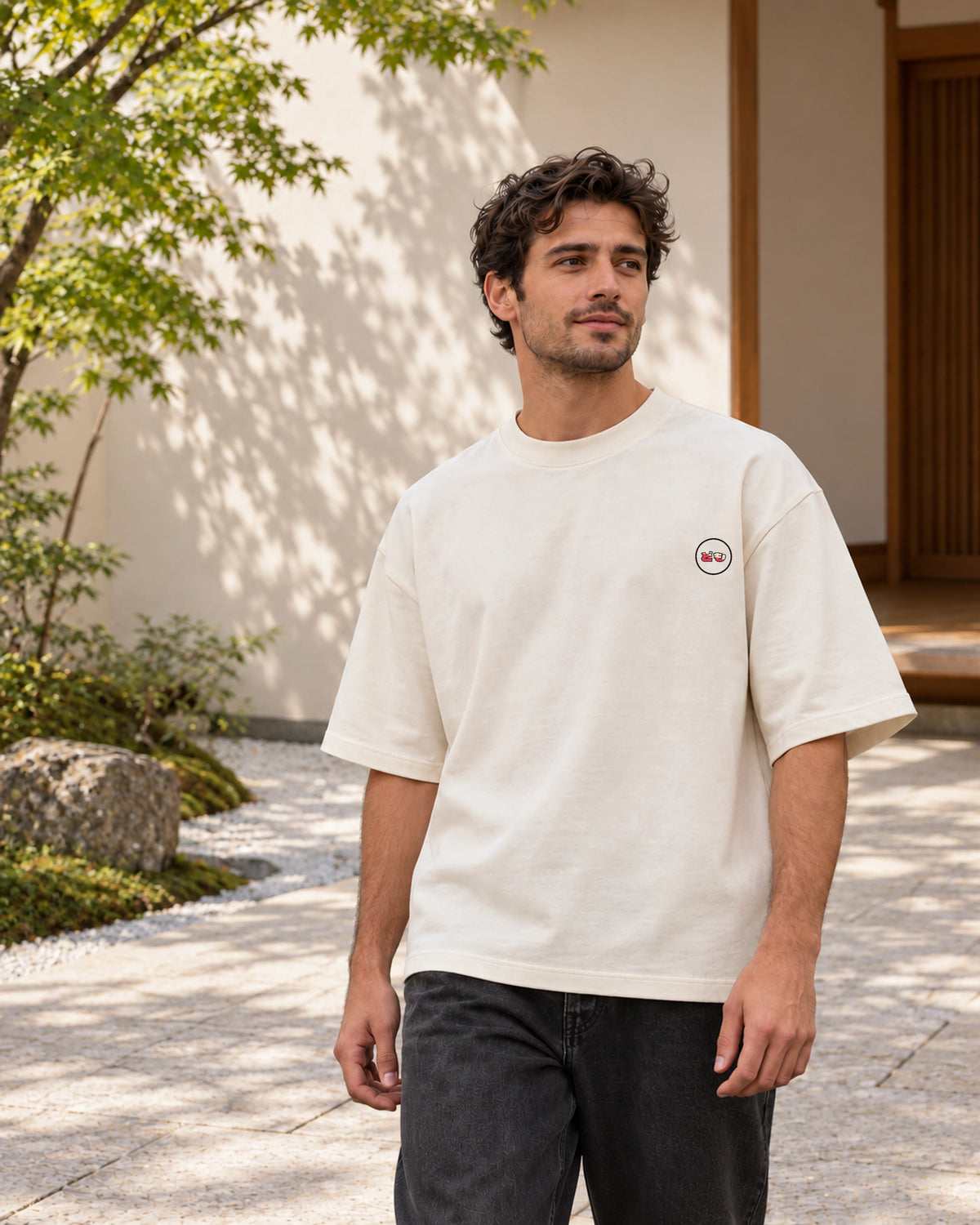 Fudō Tee 不動 | Zen Light — front view showing the Domo chest logo in a Japanese setting