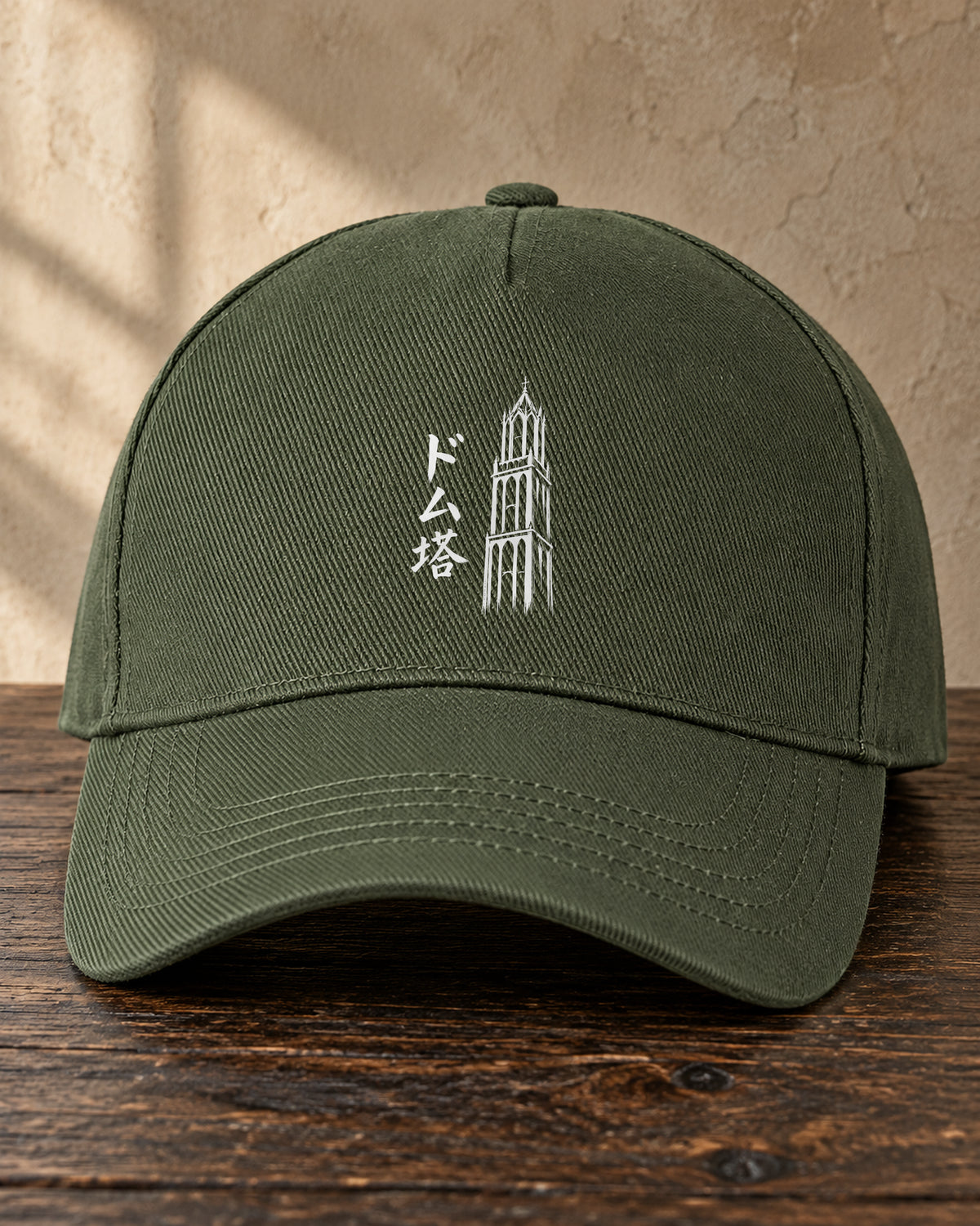 Kage Cap 影 — olive cap showing the Ink artwork